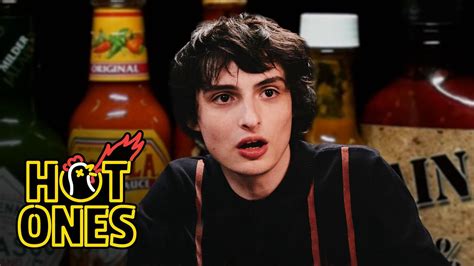 Finn Wolfhard Embraces Insanity While Eating Spicy Wings.